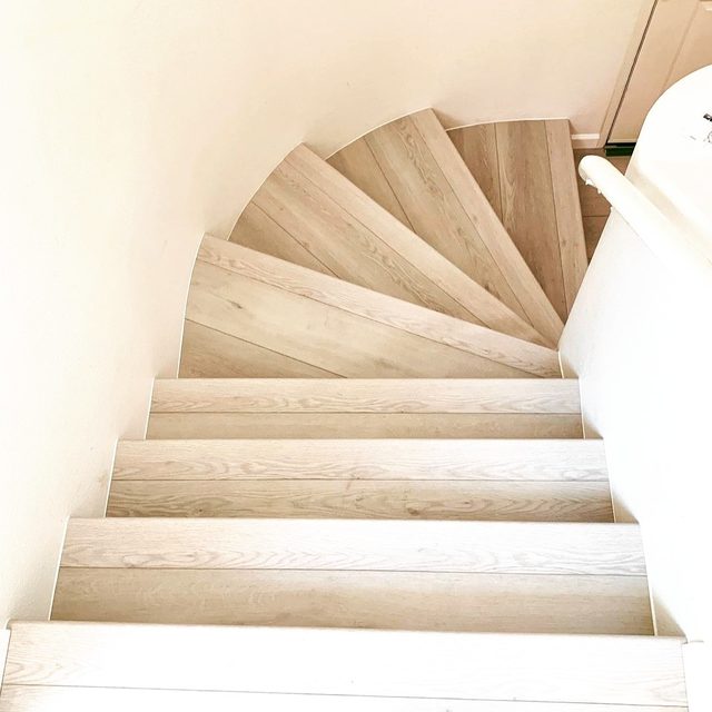 Winding staircase with light vinyl plank treads